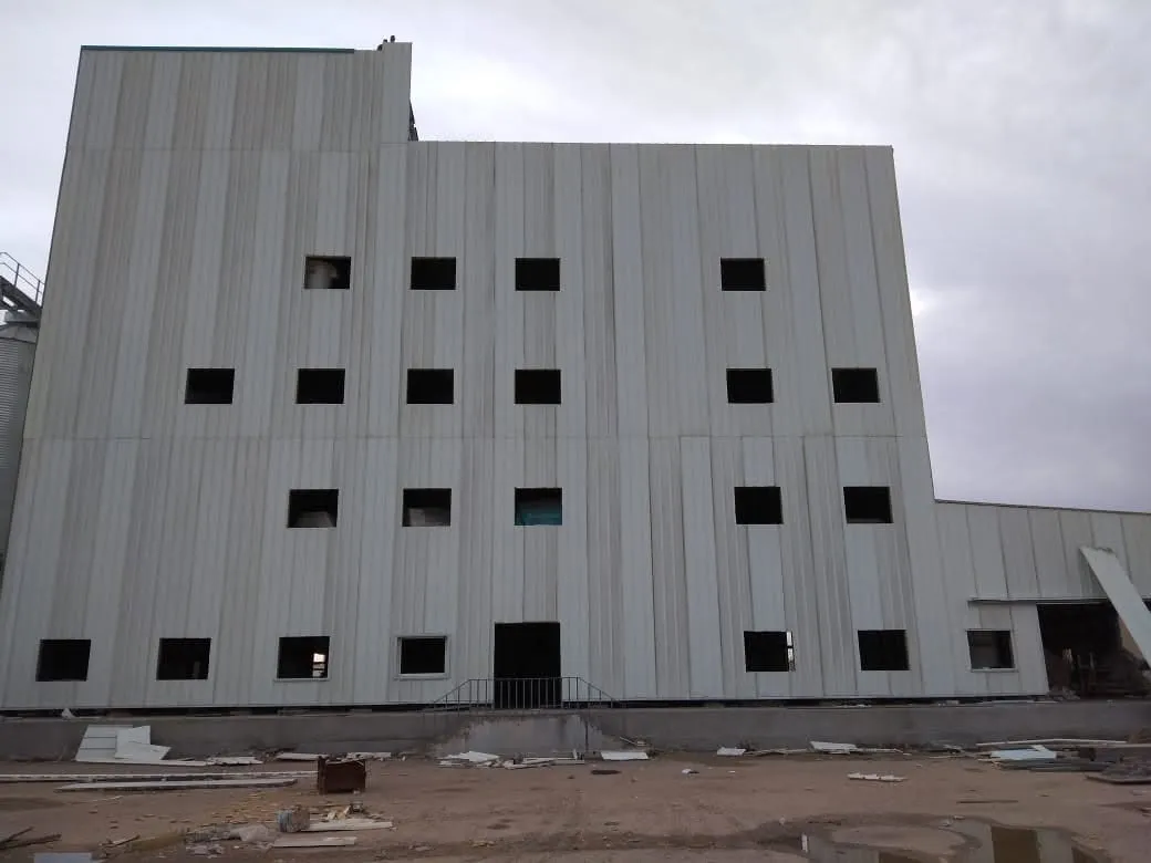 Clad steel mill building